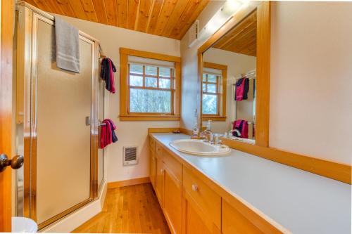 a bathroom with a sink and a mirror at Oceanside Haven in Oceanside