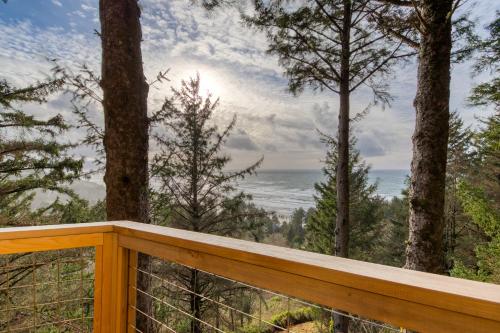 a wooden deck with a view of the ocean at Oceanside Haven in Oceanside