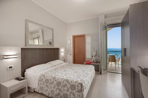 Hotel San Giorgio tesisinde bir odada yatak veya yataklar