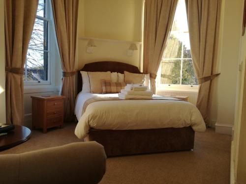 a bedroom with a bed and a window at Lubnaig Guest House in Callander