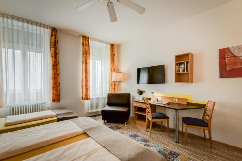 TV a/nebo společenská místnost v ubytování Gästehaus Centro