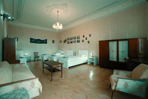 a large living room with a couch and a table at Guest House Old Kutaisi in Kutaisi