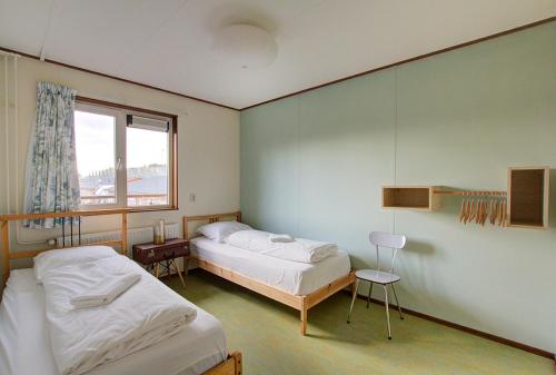 Postel nebo postele na pokoji v ubytování Amsterdam Farm Lodge