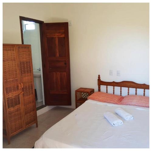 En eller flere senge i et værelse på Pousada Villa Graciela