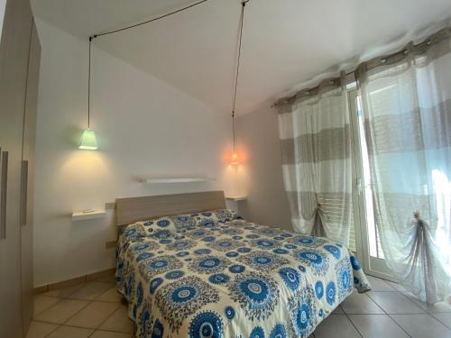 Ένα ή περισσότερα κρεβάτια σε δωμάτιο στο casa vacanze La Balena