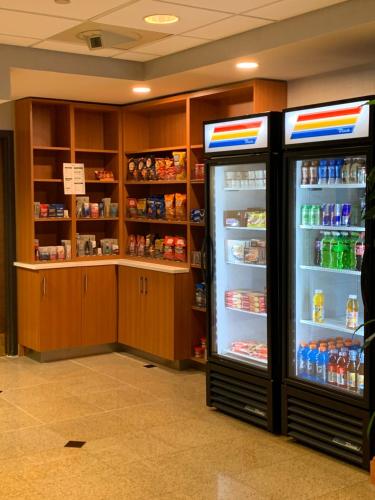 a store with two refrigerators in a room at Wingate by Wyndham Wilmington in Wilmington