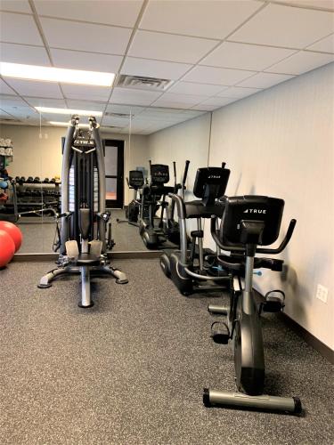 a gym with several exercise bikes and exercise equipment at Wingate by Wyndham Wilmington in Wilmington