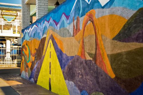 a wall with a mural of a swan on it at Expedition Lodge Moab Arches National Park in Moab