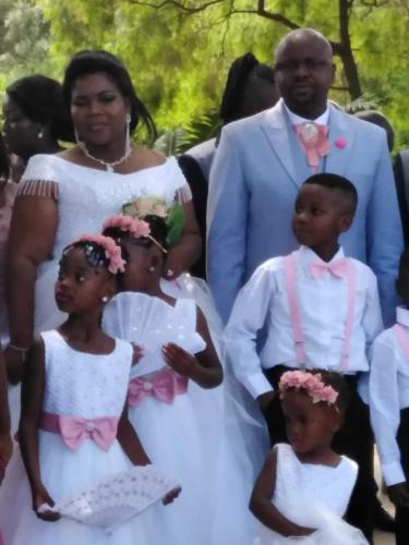 a bride and groom and their daughters in their wedding dress at La Fiato Luxury Lodge in Dalmada AH
