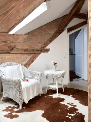 a room with two chairs and a table and a window at Appartment Kornboden Nordic Style in Schopfheim