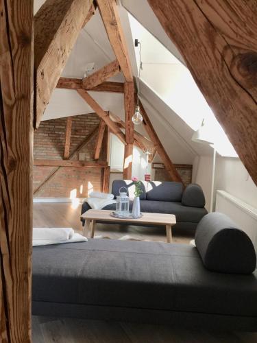 a room with two beds and a table at Appartment Kornboden Nordic Style in Schopfheim