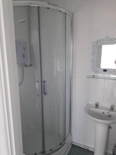 a bathroom with a shower and a sink at Bell Inn in Evesham