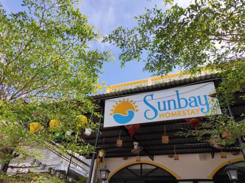 a sign on top of a building at Sunbay Homestay Cu Lao Cham in Tân Hiệp