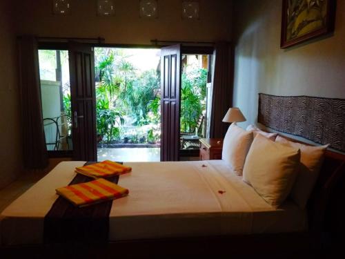 Tempat tidur dalam kamar di Sunshine Bungalows