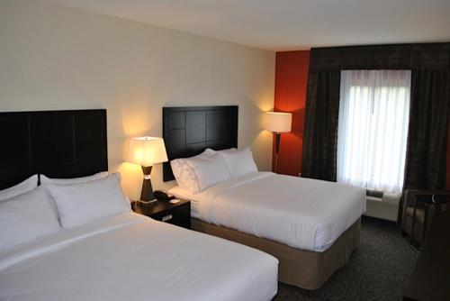 a hotel room with two beds and a window at Holiday Inn Express Salem, an IHG Hotel in Salem