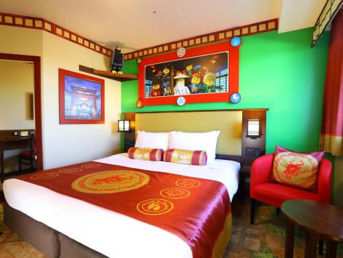 a hotel room with a large bed and a chair at LEGOLAND Japan Hotel in Nagoya