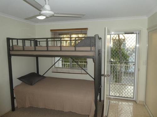 a bunk bed in a room with a window at Townsville Terrace in Townsville