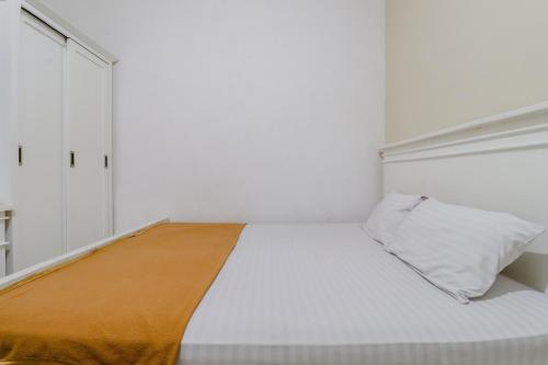 Postel nebo postele na pokoji v ubytování Ratu Guesthouse