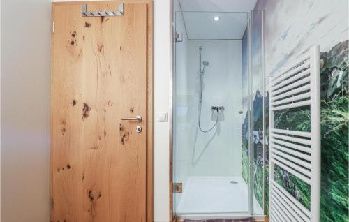 a bathroom with a shower and a glass door at Moderne Ferienwohnung-Dalaas in Dalaas