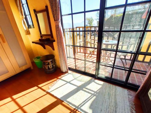 an open door with a view of a balcony at 南投清境挪威森林 in Renai