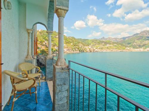 a balcony with a view of the water at Villa Scarpariello Relais in Ravello