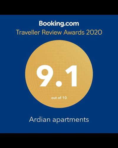 a yellow circle with the number on it at Imperial apartments in Ksamil