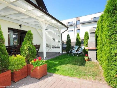 Vonkajšia záhrada v ubytovaní Domki letniskowe,apartamenty Wczasowa 8a