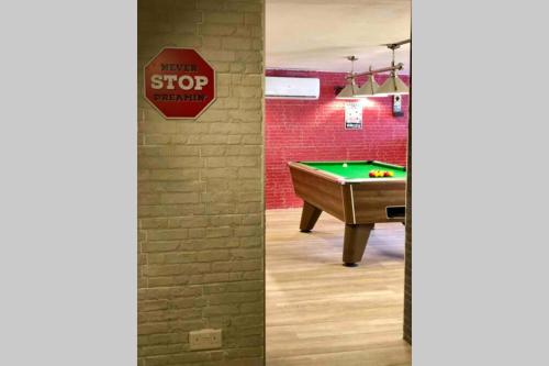 a stop sign and a pool table in a room at Modern Luxury villa in St. Julians in St Julian's