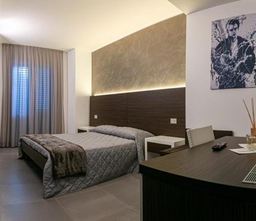 A bed or beds in a room at BRIGANTE SUITES