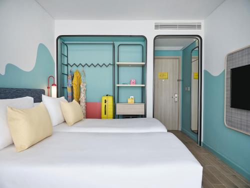 Postel nebo postele na pokoji v ubytování ibis Styles Vung Tau