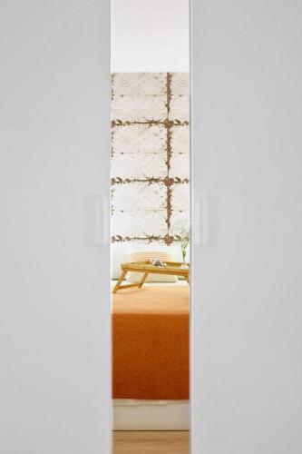 a room with a bed with a table in it at iobo apartment in Rentería