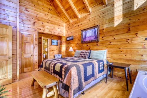 a bedroom with a bed in a wooden cabin at Moonlight Retreat in Pigeon Forge