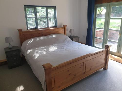 Postel nebo postele na pokoji v ubytování Church Farm Lodge