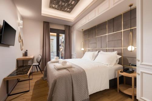 Posteľ alebo postele v izbe v ubytovaní Carpe Diem Boutique Hotel