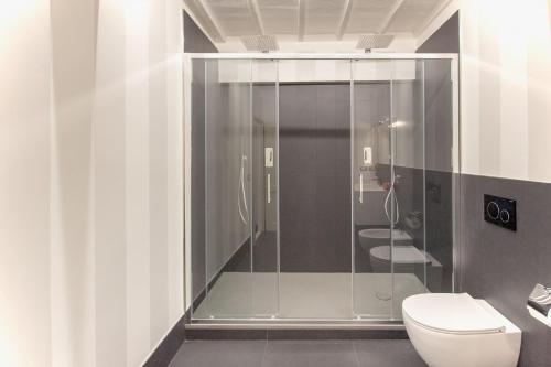 a bathroom with a shower and a toilet at Palazzo Chigi Zondadari in Siena