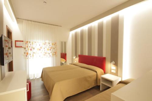 Postel nebo postele na pokoji v ubytování Hotel Toledo