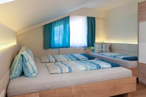 Ένα ή περισσότερα κρεβάτια σε δωμάτιο στο Apartments Jernej am Turnersee