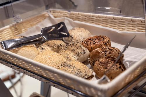 a tray of donuts sitting in a basket at Park Hotel Imperial in Limone sul Garda