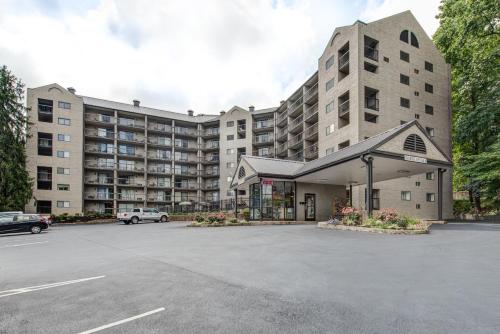 a parking lot in front of a large building at Olde Gatlinburg Rentals in Gatlinburg