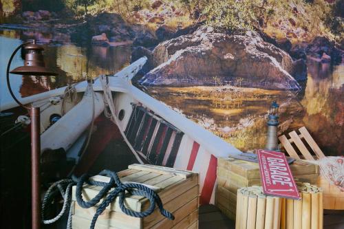 a painting on the side of a boat with a sign at Ahr Hotel Villa Alighieri in Stra
