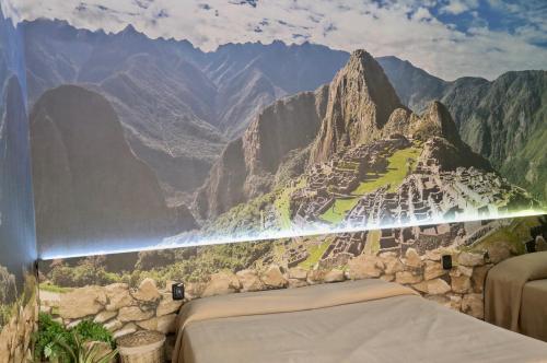 a bedroom with a view of a mountain at Ahr Hotel Villa Alighieri in Stra