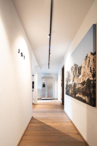 a hallway of an art gallery with a painting on the wall at KaiserMoments in Going