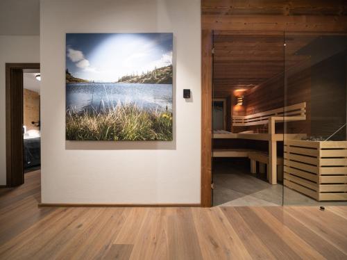 a painting on a wall in a room with a bedroom at KaiserMoments in Going