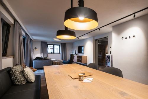 a living room with a table and a dining room at KaiserMoments in Going