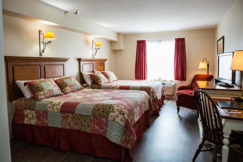 Ein Bett oder Betten in einem Zimmer der Unterkunft The Village Inn of Lakefield