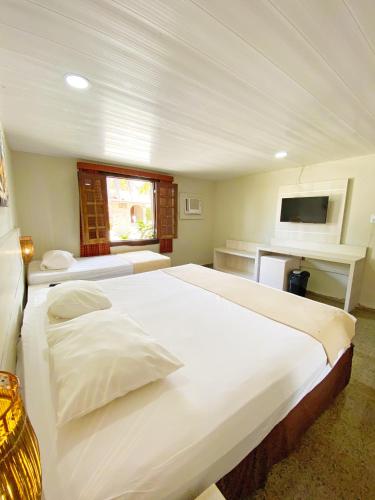 Cama o camas de una habitación en Hotel Parque das Fontes