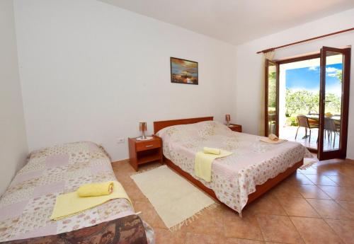 Katil atau katil-katil dalam bilik di Apartments Denis