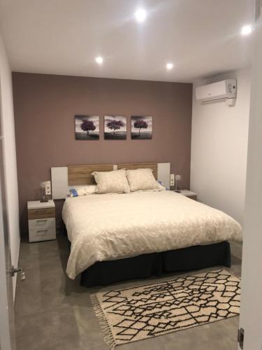 Postel nebo postele na pokoji v ubytování LA OLMA apartamentos