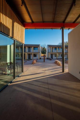 an empty courtyard of a school building with glass windows at Best Friends Roadhouse and Mercantile in Kanab