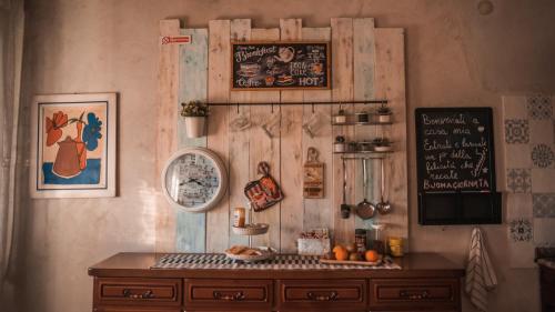 a room with a wooden wall with a desk and a chalkboard at B&B LELLA in Piove di Sacco